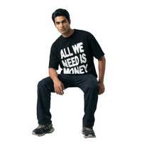 All We Need Is Moneyoversized cotton t-shirt for men and women by BOMBAE STORE